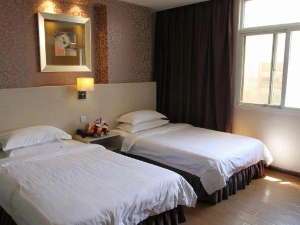 Bed in Pankun Business Hotel