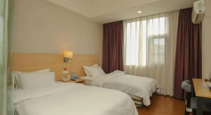 Bed in Pankun Business Hotel