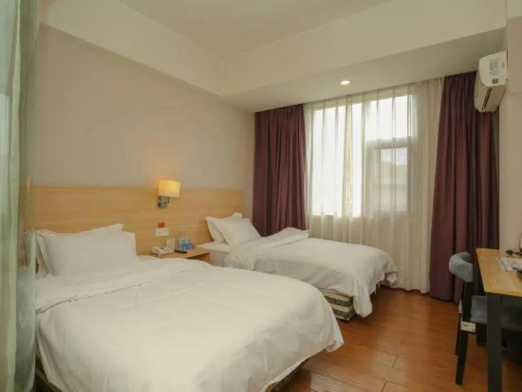 Bed in Pankun Business Hotel