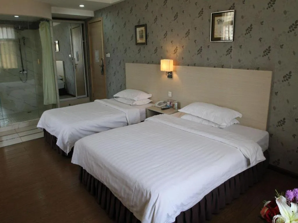 Bed in Pankun Business Hotel