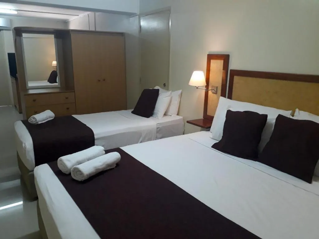 Bed in Victoria Palms Hotel