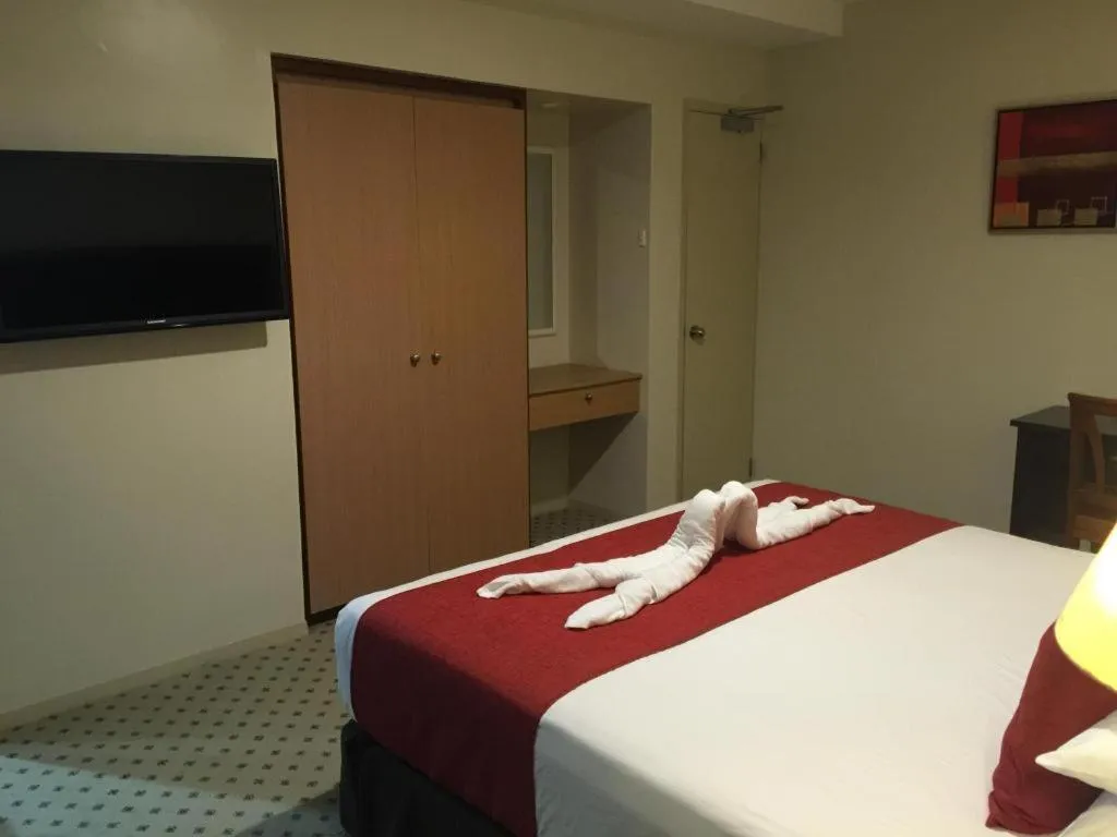 Bed in Victoria Palms Hotel