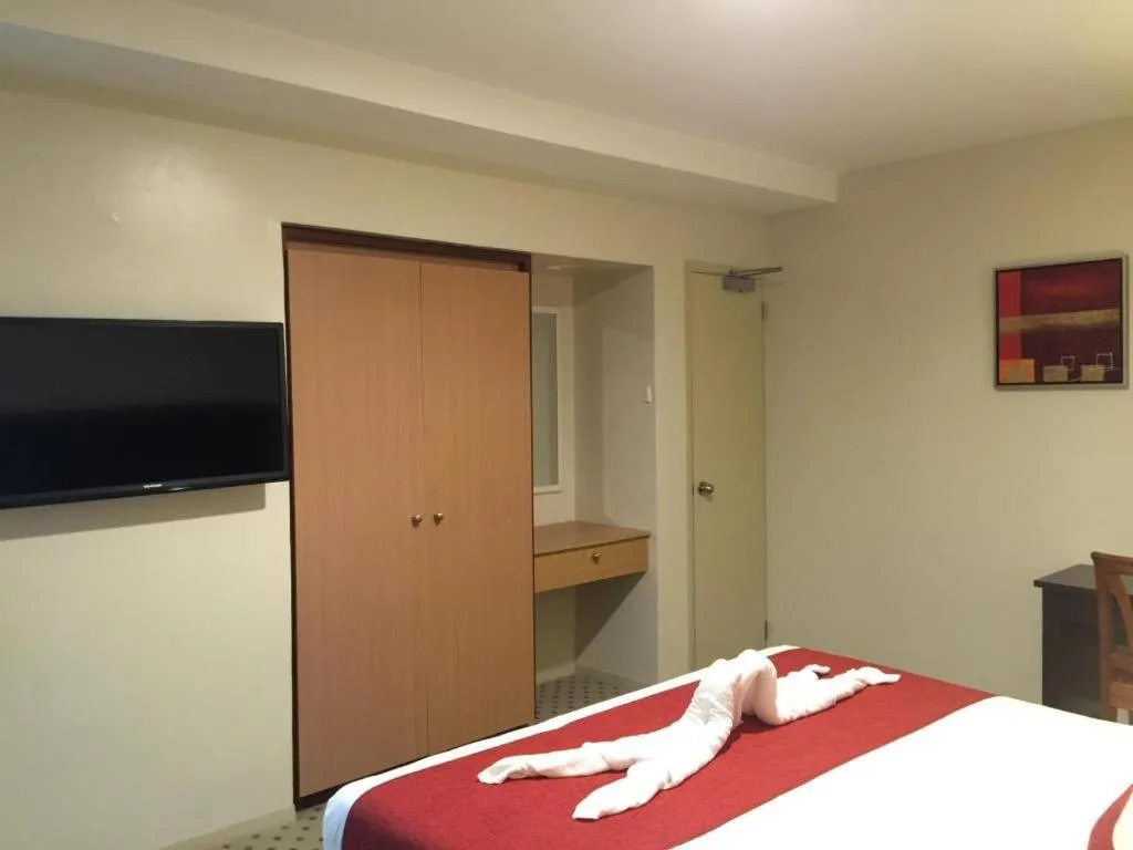 Bed in Victoria Palms Hotel