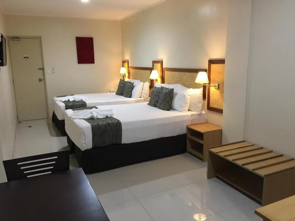 Bed in Victoria Palms Hotel