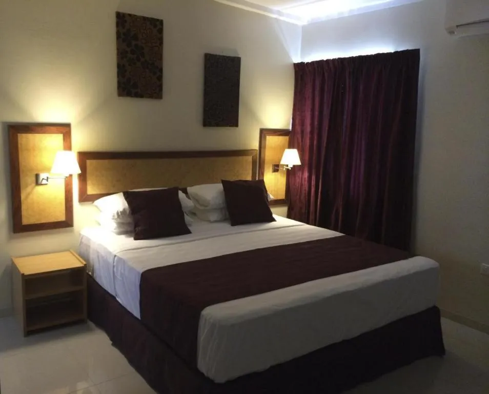 Bed in Victoria Palms Hotel