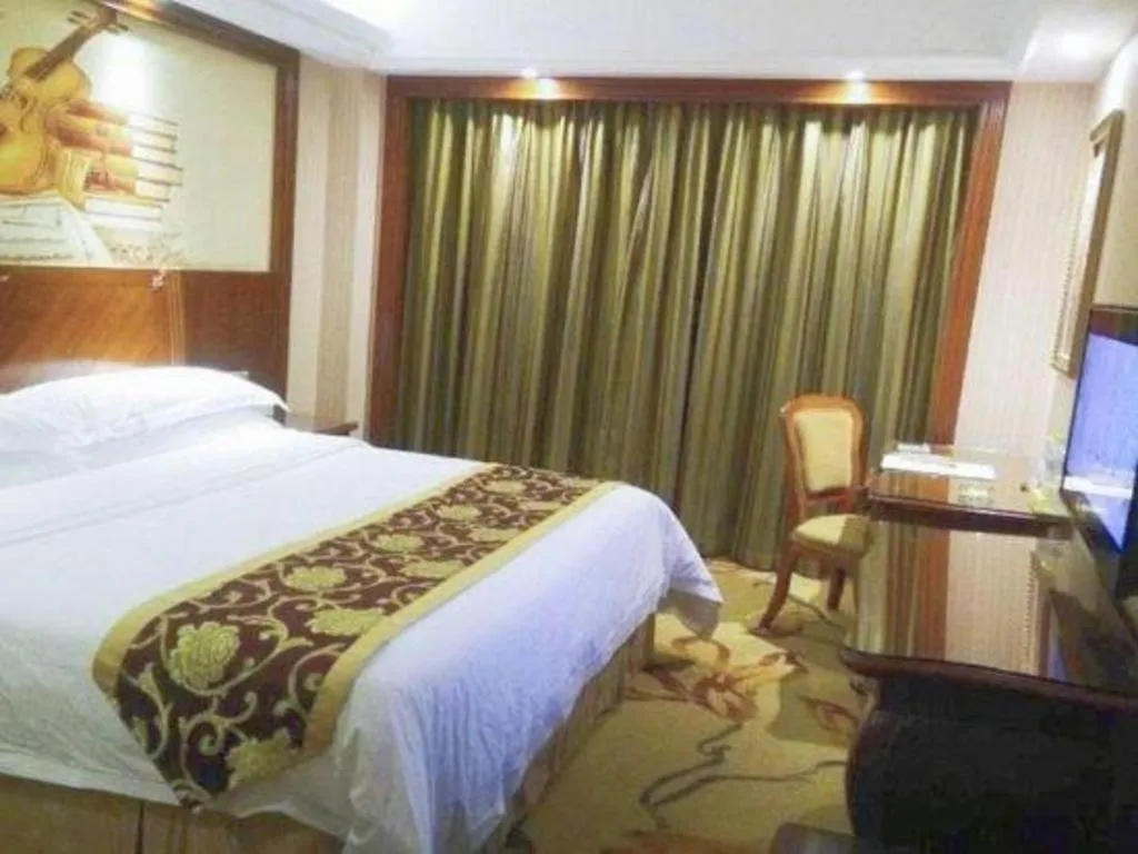 Bed in Vienna International Hotel Nanning Railway Station Mingxiu Road Metro Station