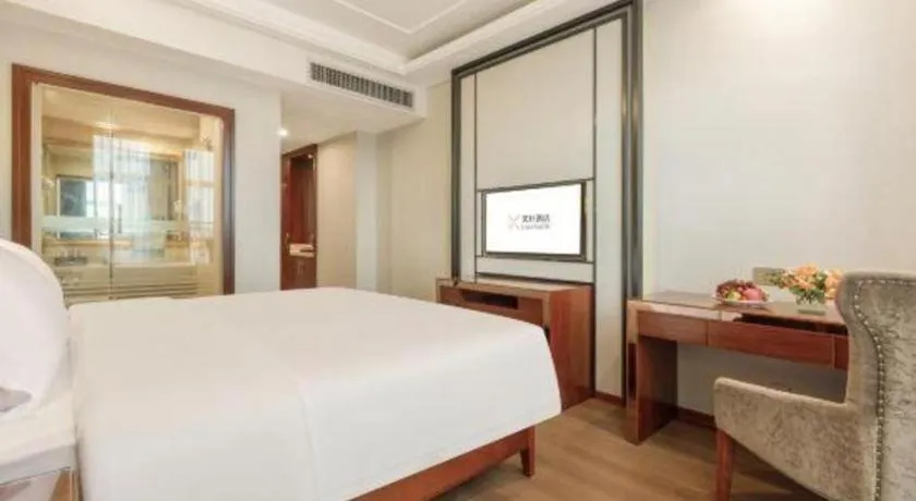 Bed in Vienna International Hotel Nanning Railway Station Mingxiu Road Metro Station