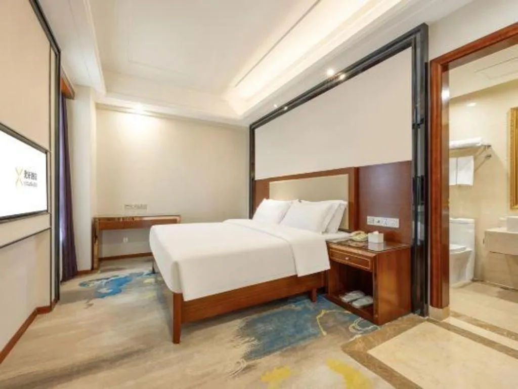 Bed in Vienna International Hotel Nanning Railway Station Mingxiu Road Metro Station