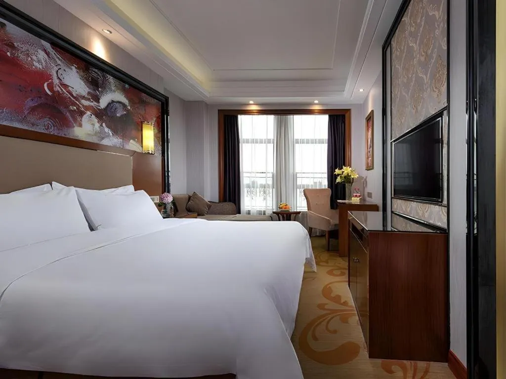 Bed in Vienna International Hotel Nanning Railway Station Mingxiu Road Metro Station