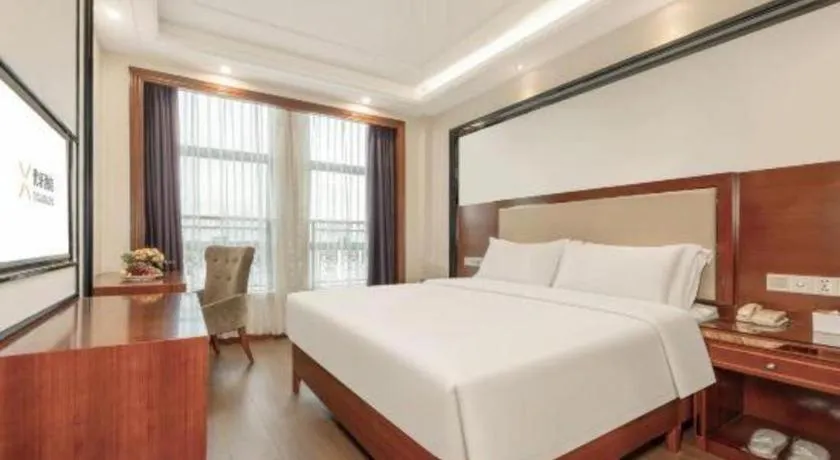 Bed in Vienna International Hotel Nanning Railway Station Mingxiu Road Metro Station