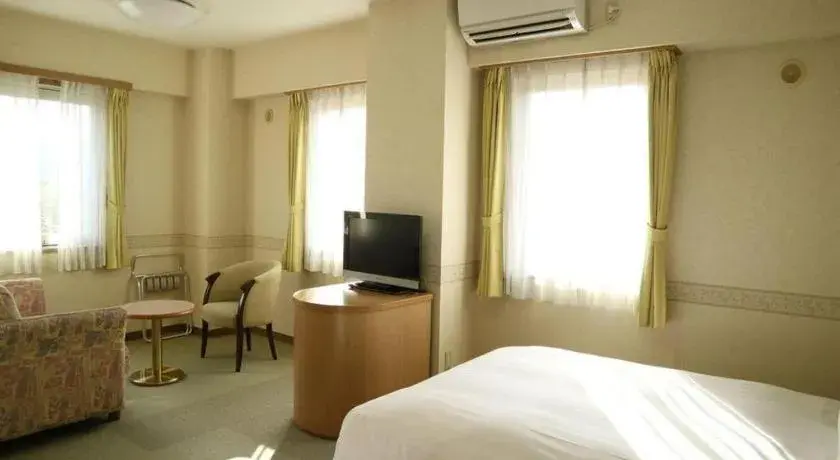 Bed in KEIKYU EX INN Yokosuka Research Park Bed in KEIKYU EX INN Yokosuka Research Park