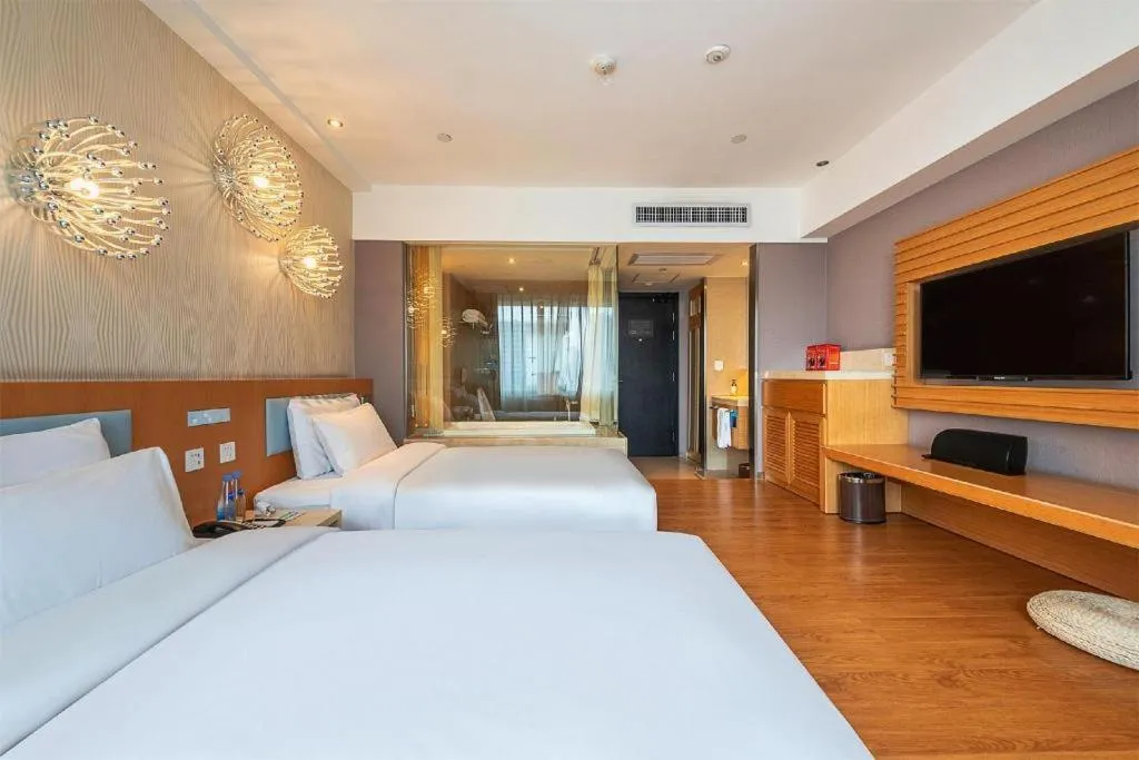 Bed in Guangzhou Crystal Orange Hotel