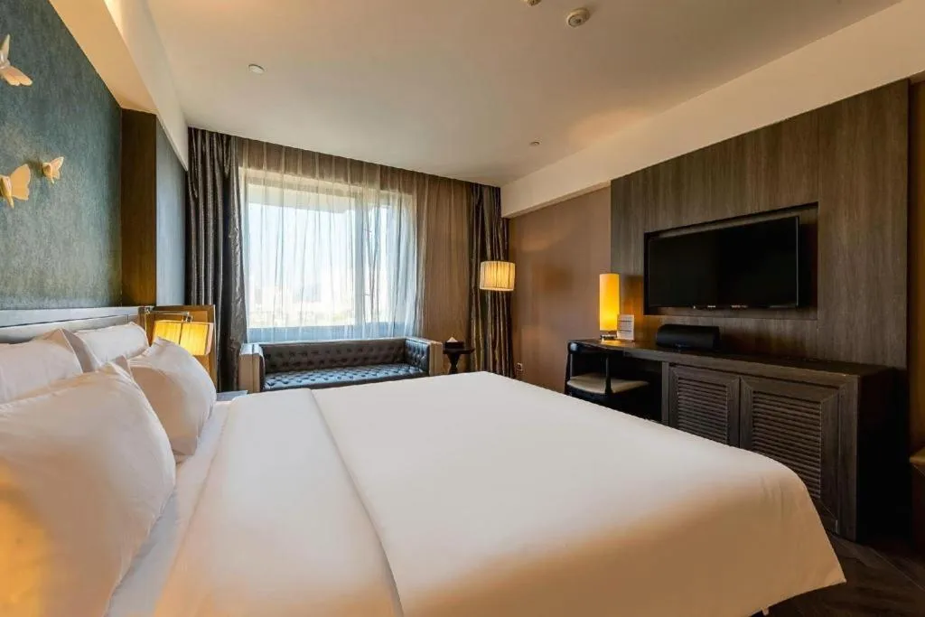 Bed in Guangzhou Crystal Orange Hotel