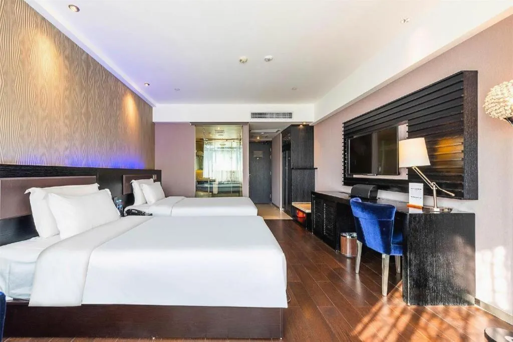 Bed in Guangzhou Crystal Orange Hotel