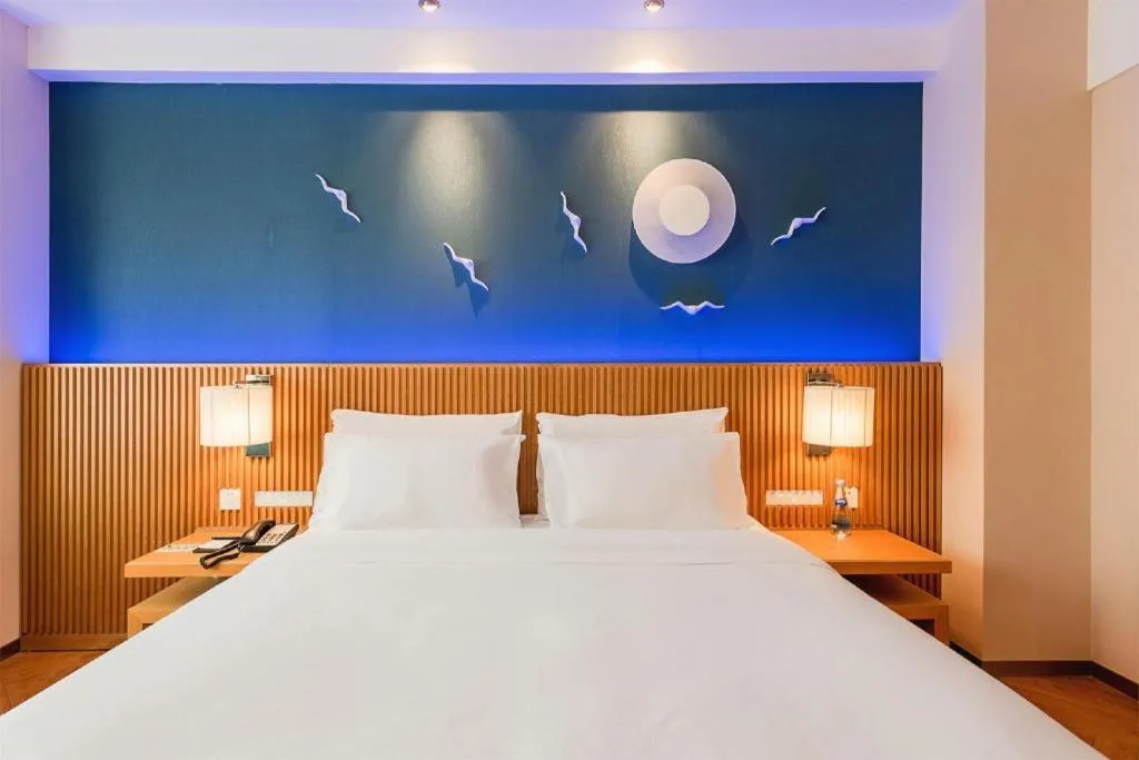 Bed in Guangzhou Crystal Orange Hotel