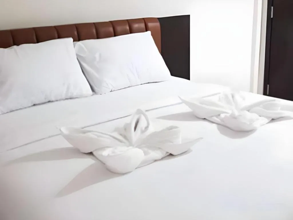 Bed in Karimun City Hotel