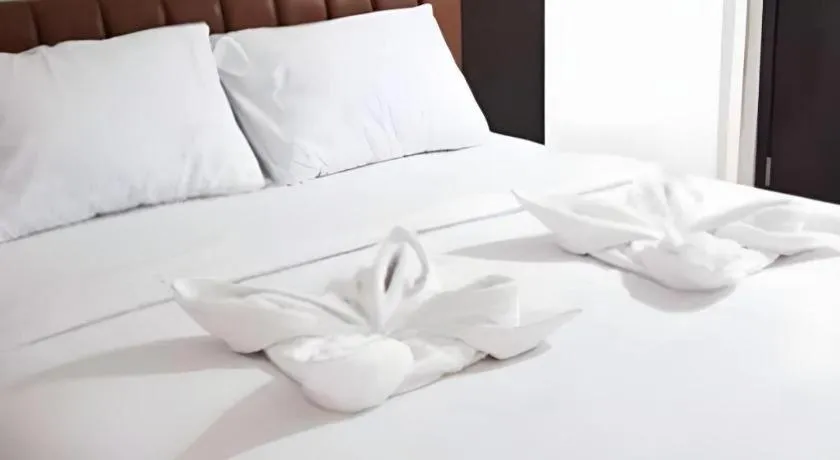 Bed in Karimun City Hotel