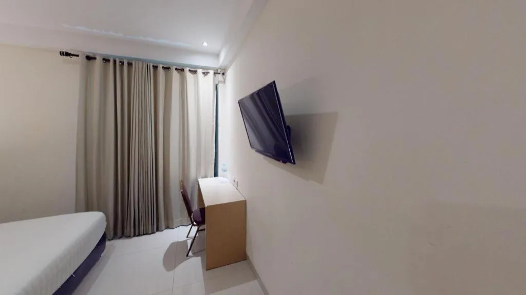 Bed in Sumi Hotel Surabaya