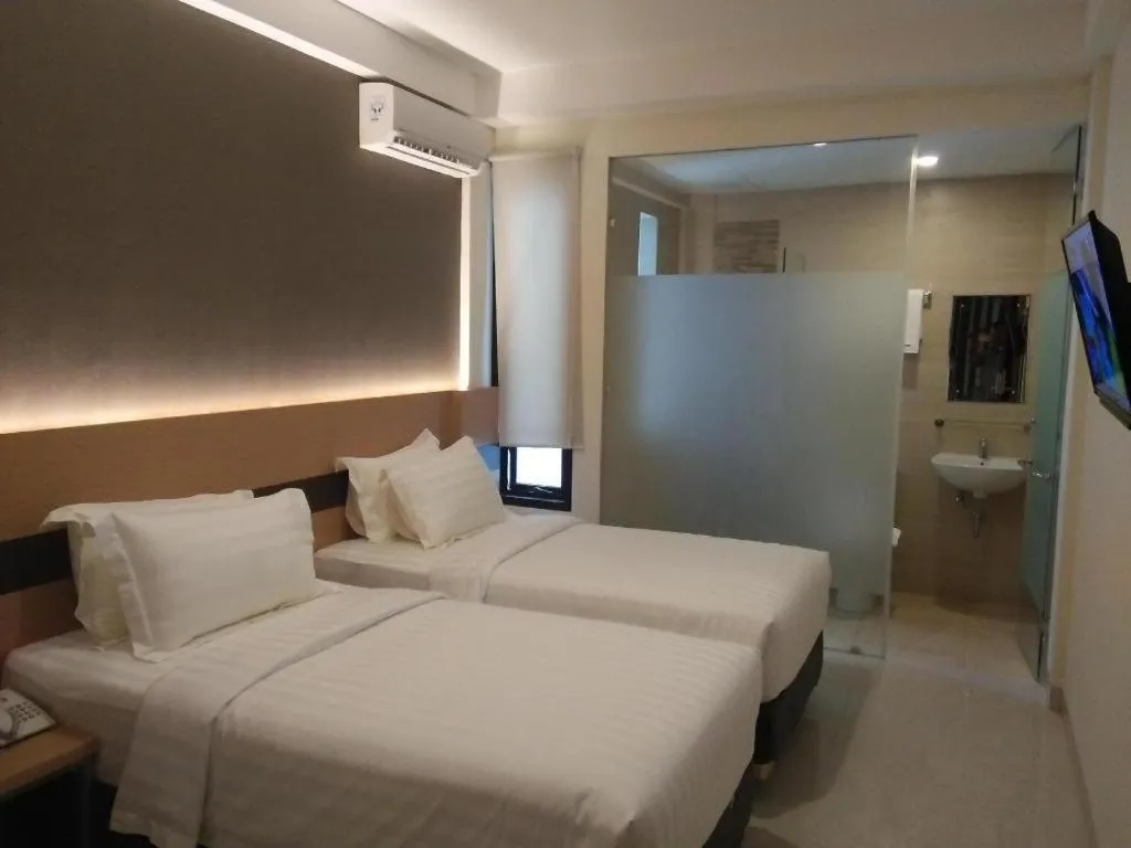 Bed in Sumi Hotel Surabaya