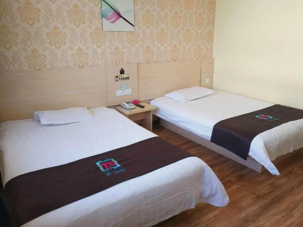Bed in Pai Hotel Tianjin Binguan Metro Station Municipal Government