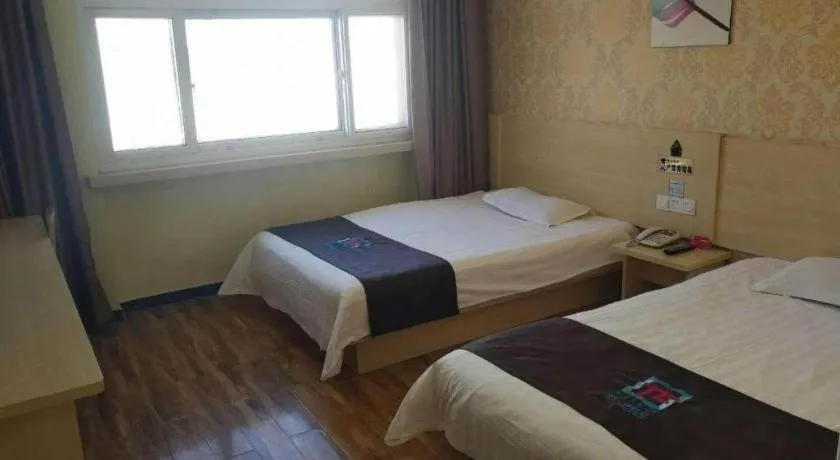 Bed in Pai Hotel Tianjin Binguan Metro Station Municipal Government
