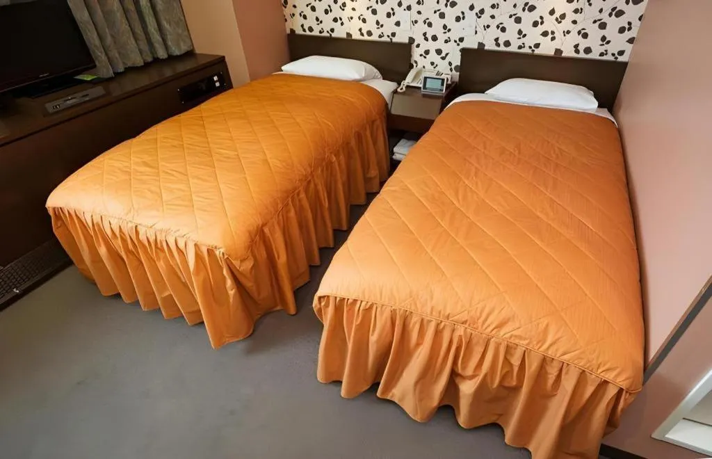 Bed in Hotel Suncity Ikebukuro