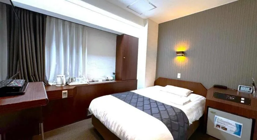 Bed in Hotel Suncity Ikebukuro