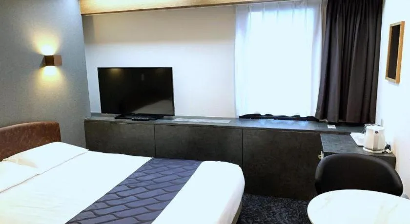 Bed in Hotel Suncity Ikebukuro