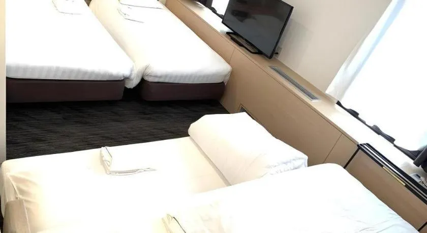 Bed in Hotel Suncity Ikebukuro