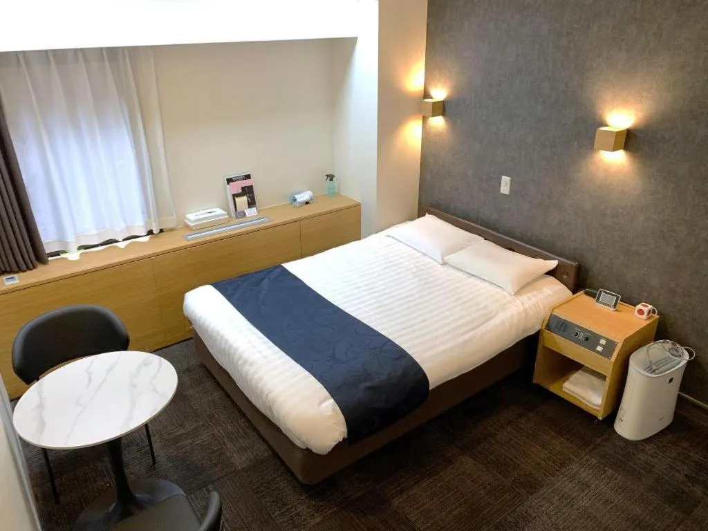 Bed in Hotel Suncity Ikebukuro