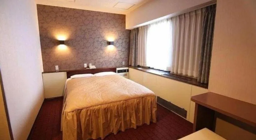 Bed in Hotel Suncity Ikebukuro