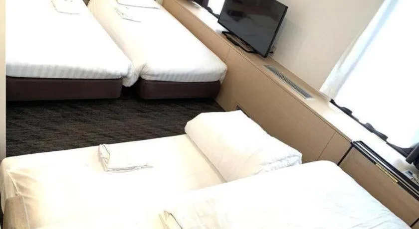 Bed in Hotel Suncity Ikebukuro