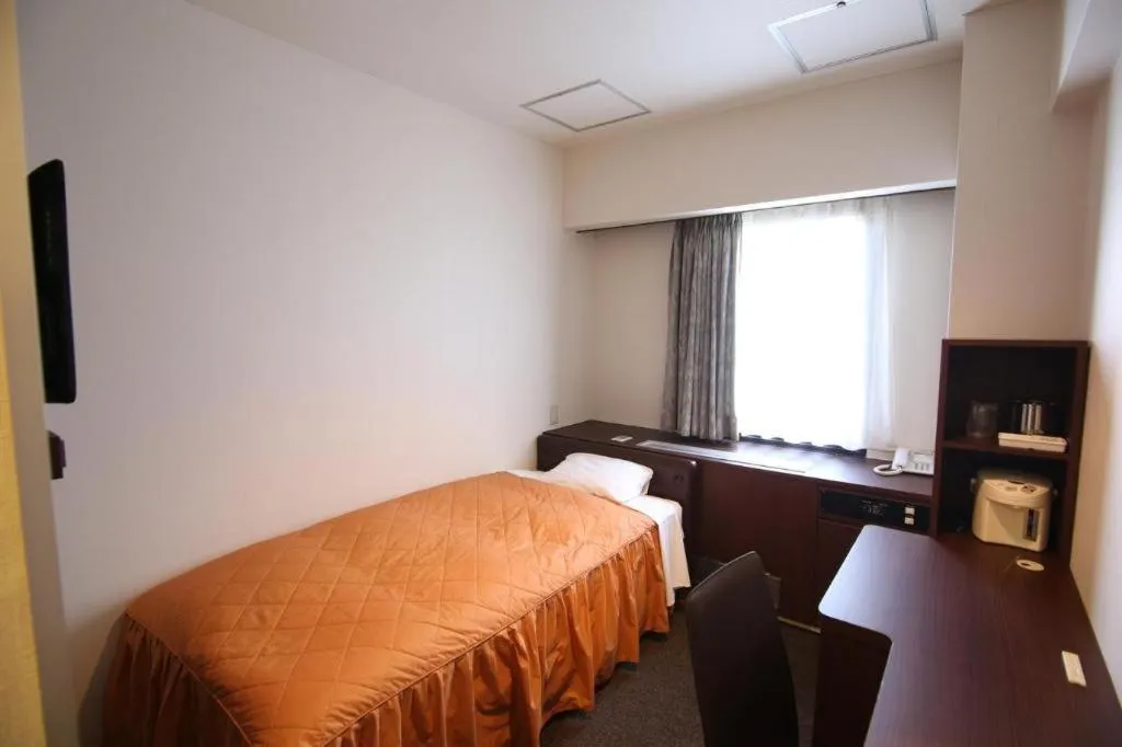 Bed in Hotel Suncity Ikebukuro