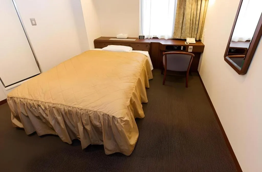 Bed in Hotel Suncity Ikebukuro