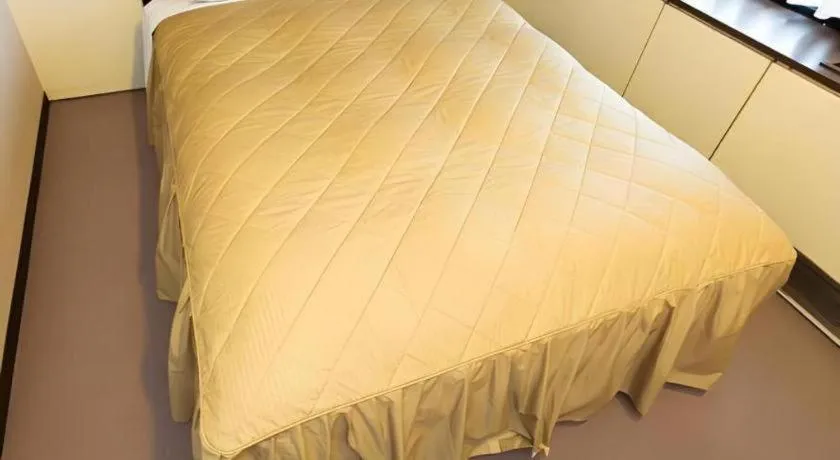 Bed in Hotel Suncity Ikebukuro