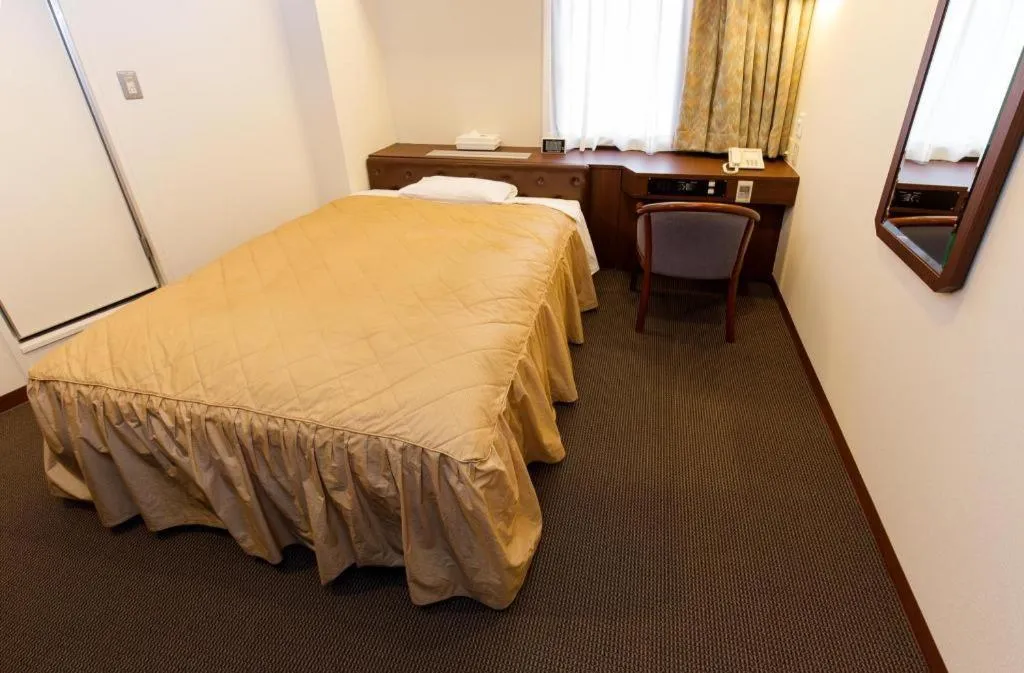 Bed in Hotel Suncity Ikebukuro