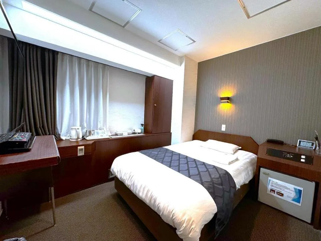 Bed in Hotel Suncity Ikebukuro