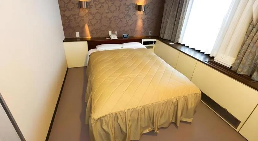 Bed in Hotel Suncity Ikebukuro