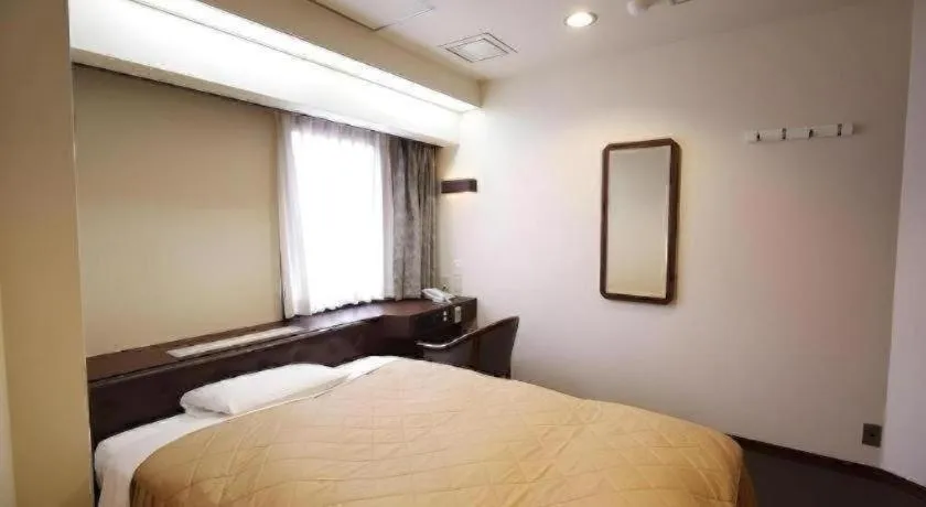Bed in Hotel Suncity Ikebukuro