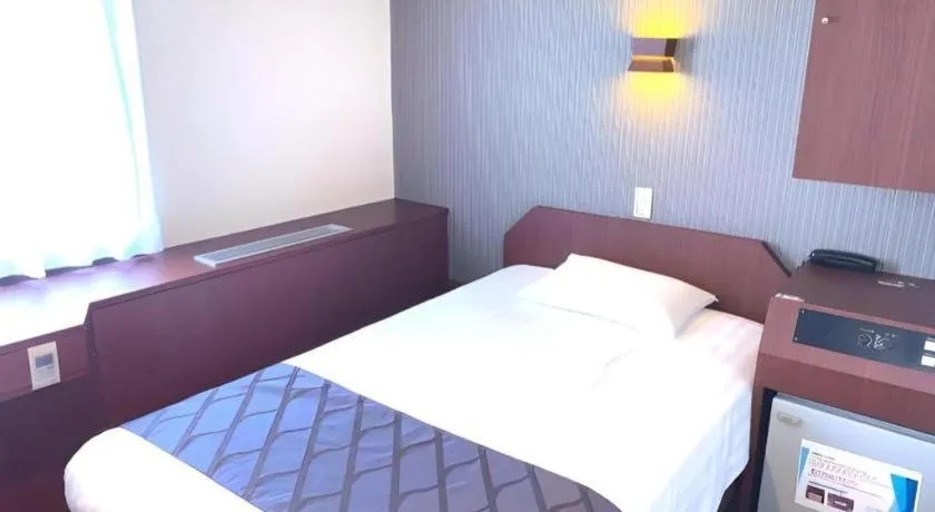 Bed in Hotel Suncity Ikebukuro