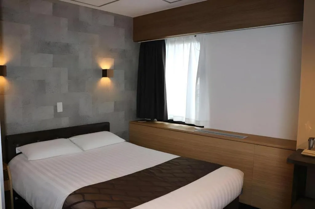 Bed in Hotel Suncity Ikebukuro