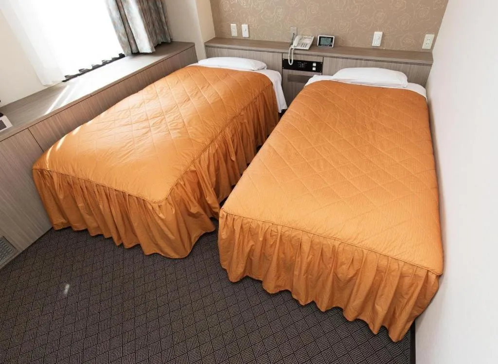 Bed in Hotel Suncity Ikebukuro