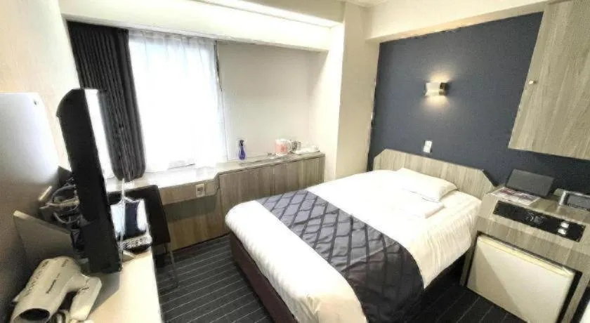 Bed in Hotel Suncity Ikebukuro