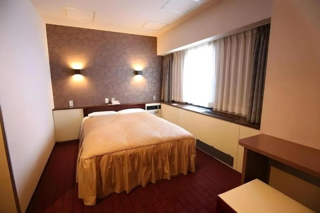 Bed in Hotel Suncity Ikebukuro