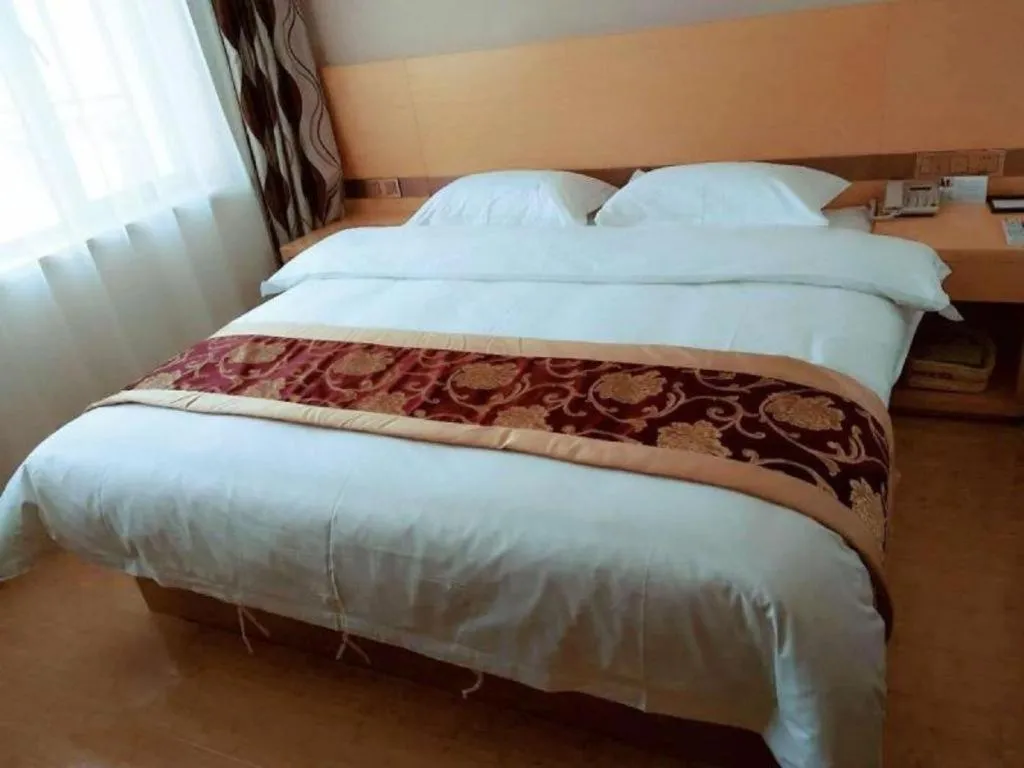 Bed in GreenTree Inn Linxia Niujinhe Avenue Express Hotel