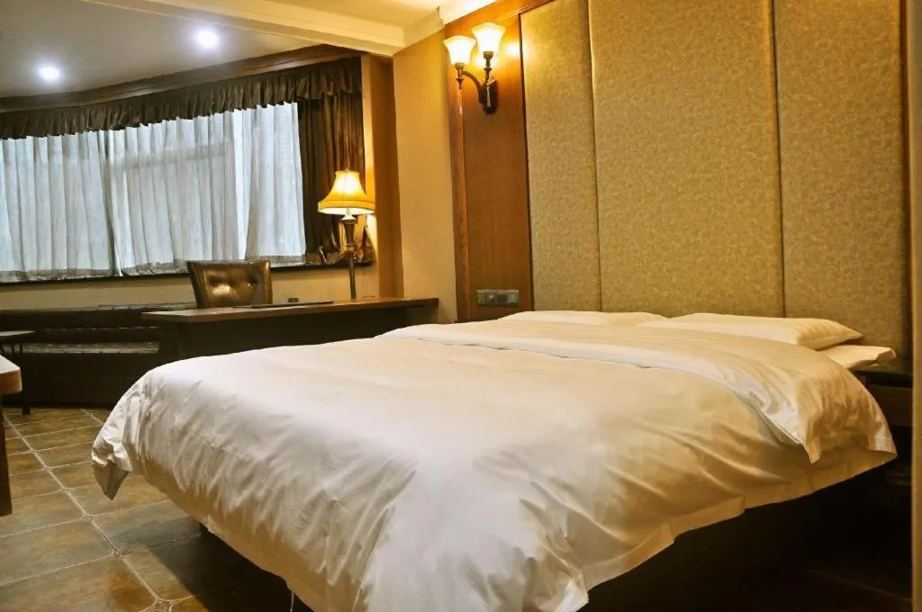 Bed in LINCOLN CARNIVAL HOTEL