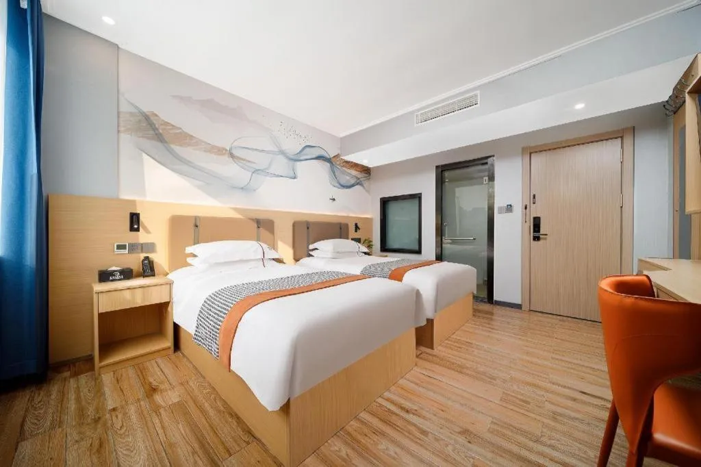 Bed in JIAN AI XI YUE HOTEL