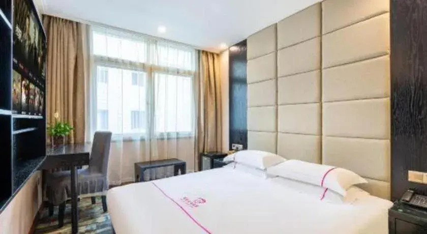 Bed in JIAN AI XI YUE HOTEL Bed in JIAN AI XI YUE HOTEL