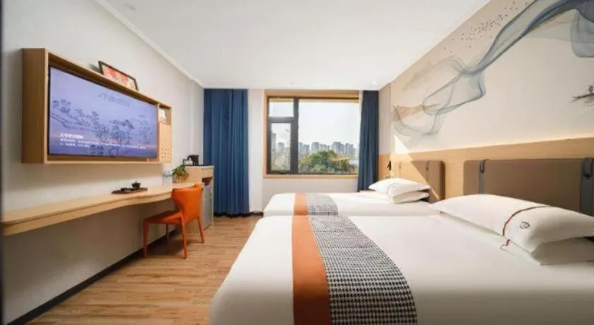 Bed in JIAN AI XI YUE HOTEL