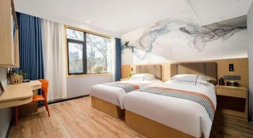 Bed in JIAN AI XI YUE HOTEL Bed in JIAN AI XI YUE HOTEL